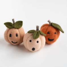 This kit includes everything you will need to create three pumpkins with their own personalities. They will bring a smile or chuckle wherever they are displayed! This kit starts with pre-formed and partially felted balls so you can get right to shaping and decorating them. Then learn to make simple leaves to adorn their tops. Suitable for beginners. Felting time: about 1 hr. per pumpkin depending on individual felting speed Kit is beautifully packaged and includes: Beginner's Guide to Needle Fel Felted Balls, Wool Mats, Acorn Crafts, Autumn Decoration, Simple Leaf, Needle Felting Kits, Wool Balls, Felt Patterns, Halloween Trees