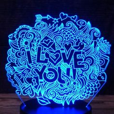 a blue light that says love you in the middle of it, with an intricate design on