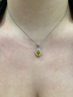 "14k white gold Pear shape/ Tear Drop Yellow Sapphire with Diamond Halo Pendant.  Material: 14k Solid white gold.  Center Stone: Natural Pear Yellow Sapphire.  Yellow Sapphire Weight: 2.06 Carats. Diamonds: 0.83 carats. Diamond Quality: VS2-SI1. Length: Top of the bail to the bottom approximately 1\". Actual Halo Stud is a little over .50 inches. Comes in a nice box.  Chain Included, select 16, 18, or 20\" at check out." Silver Jewelry With Brilliant Cut Pear Shape, Silver Pear-shaped Jewelry With Brilliant Cut, Pear-shaped Diamond Cut Jewelry In Diamond White, Pear-shaped Diamond White Jewelry With Diamond Cut, Exquisite White Gold Teardrop Pendant Necklace, Silver Platinum Pear-shaped Necklace, White Gold Pear-shaped Necklace For Formal Occasions, Pear-shaped Platinum Silver Necklace, Pear-shaped White Gold Necklace For Formal Occasions