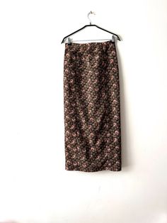 "Vintage summer pencil skirt Brown patterned maxi midi skirt 90s Romantic city skirt  Small to medium size Skirt Summer Office Skirt Estimated size: S/M Measurements:  Length:  38\"/ 96.5 cm Waist:  29\"/ 73.7 cm Hips: 39\"/ 99 cm Please check measurements to insure a proper fit. Remember to allow yourself some extra room for movement. You can compare these with something from your closet that fits you well. This skirt will come to you freshly laundered and ready to wear. Please feel free contact me if you need additional measurements or have any questions Condition: great vintage condition SHIPPING * I ship worldwide via Priority mail (Latvijas Pasts) from Latvia (EU). * I ship from Europe, so please allow 2 to 4 weeks for the package to arrive if you live overseas. * Europe 5 - 10 busine Relaxed Floral Print Pencil Skirt, Relaxed Pencil Skirt With Floral Print, Patterned Floral Print Long Skirt, Patterned Long Skirt With Floral Print, Patterned Long Skirt With Lining, Long Patterned Lined Skirt, Vintage Lined Pencil Skirt For Spring, Summer Pencil Skirt, Summer Pencil Skirts