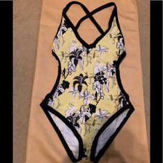 Calvin Klein Adorable 1pc. Criss Cross Open Back Swimsuit W/Bikini Style Bottom, This Has Been Washed But Never Worn. It Is A Size 10 But Runs Super Small, It Fits Like A Size 8. My Intention Was To Keep It And Lose A Little Weight And That Never Happened! The Colors Are Black, White, And Lemon Yellow, Excellent Condition. Yellow Stretch One-piece Beachwear, Yellow Lined Swimwear For The Beach, Yellow Lined Swimwear For Vacation, Yellow Beachwear Swimwear With Lined Body, Yellow Lined Swimwear For Beach, Yellow One Piece Swimwear For Beach, Yellow Lined Swimwear For Sunbathing, Yellow One-piece Beachwear For Swimming, Yellow Lined Beachwear Swimwear