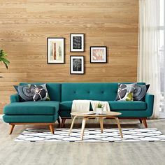 a living room scene with focus on the couch and coffee table in front of it