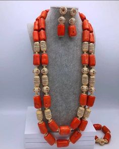 Nigerian wedding jewelry for special occasions. This is original Italian coral made into 2 steps ganished with non tarnish gold accents. The bride set includes 1 elastic bracelet and a set of earrings. Production takes 7 business days Feel free to start a conversation with me. Thank you. Nigerian Beads, Nigerian Wedding Dress, Nigerian Traditional Wedding, Coral Jewelry Set, African Traditional Wedding Dress, African Traditional Wedding, African Clothing Styles, Coral Jewelry, African Beads