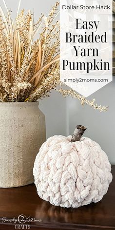 a white pumpkin sitting on top of a wooden table