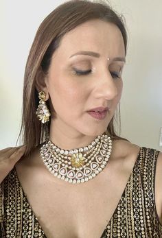 Introducing our exquisite Kundan Necklace, the epitome of elegance and opulence. This stunning piece has just arrived in stock and boasts the highest quality craftsmanship and an unparalleled shine. Handcrafted by master artisans, the necklace features intricately set Kundan stones that radiate brilliance from every angle. Perfect for special occasions or to elevate your everyday look, this necklace is a timeless addition to any jewelry collection. Experience the luxury and grandeur of our fines Elegant Heavy Kundan Necklace For Party, Elegant Heavy Bridal Necklace, Luxury Kundan Jewelry, Luxury Jewelry Set With Intricate Design For Festive Occasions, Designer Gold Kundan Necklace For Gift, Luxury White Kundan Necklace For Festive Occasions, Elegant Kundan Bridal Necklace With Jewels, Designer Gold Necklace For Festive Occasions, Designer Gold Necklaces For Festive Season