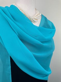 Elevate your style with our exquisite collection of chiffon shawls. Our chiffon shawls are the epitome of elegance and versatility, designed to effortlessly enhance your wardrobe and leave a lasting impression. Made from the fine poly chiffon fabric, these shawls offer a delicate and airy drape that adds a touch of grace to any outfit. Whether you're attending a special occasion, a casual gathering, or simply want to elevate your everyday look, our chiffon shawls are the perfect accessory. Choos Elegant Blue Scarves For Wedding, Elegant Blue Scarf For Wedding, Elegant Blue Silk Shawl Scarf, Elegant Silk Chiffon Scarves For Wedding, Elegant Blue Silk Shawl, Elegant Blue Shawl Scarves, Elegant Blue Silk Scarf For Formal Occasions, Elegant Silk Chiffon Scarf For Wedding, Elegant Green Silk Scarf