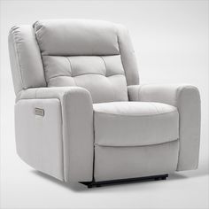 a white recliner chair sitting on top of a white floor