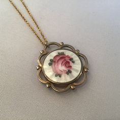 "Antique Art Nouveau Guilloche Locket filled with rubies. The gemstones move freely in the double-sided locket. The precious gems are gorgeous and beautiful quality. I meticulously search the world for the best quality and price. The gold-plated Guilloche round locket is from the early 1900's and a Gorgeous statement piece. It has a diameter of approx. 1 1/8\" and sparkles with rubies! It hangs from a 18\" gold-plate chain that extenders to 30\". It will come to you in a gift box. The Perfect gi Oval Enamel Locket Jewelry, Gold Enamel Jewelry With Detachable Pendant, Antique Enamel Locket Jewelry, Vintage Enamel Jewelry With Vintage Charm, Vintage Enamel Jewelry For Collectors, Vintage Enamel Jewelry For Anniversary, Oval Enamel Locket Necklace, Enamel Pendant Jewelry For Wedding, Enamel Pendant Jewelry For Weddings