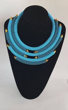 Perfect piece to add to your jewelry set! 100% handcrafted using turquoise and black fine beads. **Buy multiple items and pay shipping for 1 item only.The rest ships free. More neckleces here; https://www.etsy.com/shop/TribalTess?ref=seller-platform-mcnav&section_id=21306083 Back to my shop; https://www.etsy.com/shop/TribalTess?ref=seller-platform-mcnav Turquoise And Black Beads Necklace For Jewelry Making, Handmade Turquoise Bib Necklace With Adjustable Fit, Handmade Adjustable Turquoise Bib Necklace, Turquoise Beaded Bib Necklaces, Handmade Turquoise Bib Necklace With Round Beads, Turquoise Beaded Chain Choker Necklace, Beaded Turquoise Necklace With Round Beads, Handmade Blue Turquoise Necklace, Turquoise Beaded Necklaces With Spacer Beads