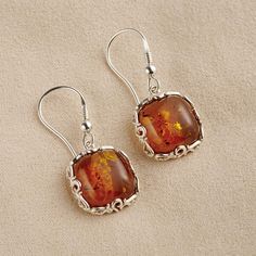 The Fossilized Baltic Amber Earrings - Hammacher Schlemmer Silver And Amber Earrings, Classic Orange Jewelry As Gift, Classic Orange Jewelry For Gift, Elegant Amber Sterling Silver Earrings, Classic Amber Earrings For Gift, Amber Sterling Silver Dangle Earrings, Classic Amber Sterling Silver Earrings, Amber Sterling Silver Earrings, Handmade Amber Sterling Silver Jewelry