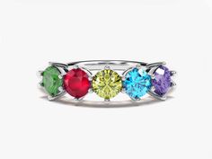 Show your love in a colorful way with our round-shaped birthstone ring, customizable with the birthstones of your choice. A stylish and meaningful gift for mothers and grandmothers to celebrate Mother's Day and their infinite love. FEATURES Gemstone: AAA-Grade Lab-Grown Gemstones Setting Types: ProngShape: Round Cut: ExcellentStone Sizes: 5 x 4.00 mm (1.25 ct)Band width: Min: 1.90 mm, max: 5.70 mmBand thickness: Min:1.65 mm, max: 2.40 mmReady to Ship: 4-5 Business Days Model Name: ECWB000199Avai Multicolor Birthstone Ring With Prong Setting As Gift, Multicolor Birthstone Ring With Center Stone As Gift, Rainbow Birthstone Ring For Anniversary, Multicolor Birthstone Ring For Anniversary, Multicolor Prong Set Round Birthstone Ring, Multicolor Prong Set Birthstone Ring, Multicolor Birthstone Ring With Accent Stones For Anniversary, Mother's Day Birthstone Ring With Gemstone, Multicolor Rings For Gifts