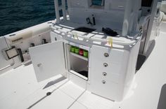 an open cabinet on the back of a boat