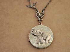 Even the most opposite kinds can be best of friends.   Baby elephant brass stamping torch soldered on vintage 70s basket weave patterned brass locket and accented with tiny brass sparrow on top. Locket hangs under unique Victorian style connector and it hangs on 24 inch long antiqued brass chain with lobster clasp as shown in last picture.   Measurement: Locket is about 1.25 inch (31mm) wide. Default chain length is 24 inches as shown in last picture or simply choose a preferred length when chec Antique Gold Stamped Jewelry Gift, Bronze Stamped Jewelry As A Gift, Bronze Stamped Jewelry For A Gift, Gift Bronze Stamped Jewelry, Personalized Vintage Antique Silver Jewelry, Vintage Bronze Jewelry For Crafting, Vintage Round Pendant Jewelry For Crafting, Vintage Brass Jewelry For Crafting, Vintage Round Pendant For Crafting Jewelry