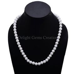 Product Details : Item Code : DGC080Gemstone Name :  WHITE CORALChain Style : BEADEDBeads Shape : SMOOTH ROUNDBeads Size : 8 MM ApproxLength : 18" Inch ApproxWeight : 255 Cts. ApproxCustomization : **Available**Please Feel Free To Contact If You Have Any Query. Pearl White Single Strand Necklace With Round Beads, Pearl White Faceted Beads Necklace For Gift, Pearl White Necklaces With Faceted Beads For Gifts, Pearl White Necklace With Faceted Beads For Gift, White Pearl Necklace With Gemstone Beads As A Gift, Classic White Jewelry With Polished Beads, White Faceted Beads Round Jewelry, Pearl White Gemstone Bead Necklace For Gifts, Pearl White Gemstone Beads Necklace As Gift