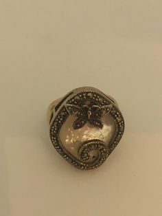 Vintage hand made about an in long Mother of Pearl set in 925 Sterling Silver Marcasite ring I have size 5.5 Can be re sized for you, my jeweler would charge $10 All rings are shipped in a nice gift box. Check out our over a THOUSAND great reviews Engraving is $4 per letter and is not always perfect depending on the piece. It can take a few days if the jeweler is busy. This is payable to Paypal Judithsltd@gmail.com Antique Open Ring Jewelry For Gift, Unique Sterling Silver Butterfly Ring, Vintage Handmade Butterfly Ring Gift, Handmade Vintage Butterfly Ring For Gift, Handmade Vintage Butterfly Ring Gift, Antique Style Open Ring Jewelry, Stamped 925, Victorian Pearl Ring Gemstone Gift, Antique Open Ring Jewelry Stamped 925, Victorian Pearl Ring With Gemstone For Gift