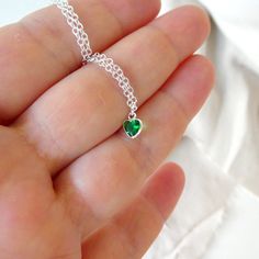 "Sterling Silver necklace with zircon emerald. Size shown is 16\". Please choose your favorite necklace length at checkout. All lengths have a one inch extender, that way you'll have some wiggle room to play with the length. For example, if you choose a 14 inches necklace length, you'll have options to close the necklace at any length between 14 inches and 15 inches. ⇒ MATERIALS Entirely made of .925 sterling silver and a zircon. ⇒ LENGTH Available in several lengths at checkout. Kindly choose y Heart-shaped May Birthstone Jewelry Gift For Her, Heart-shaped May Birthstone Jewelry As A Gift For Her, Heart Cut Emerald Necklace For Gift, Emerald Heart Charm Jewelry, Green Heart-shaped Jewelry Gift For Her, Heart-shaped Emerald Necklace For Gift, Heart Charm Necklace For May Birthstone Gift, Green Heart-shaped Sterling Silver Jewelry, Green Sterling Silver Heart Jewelry