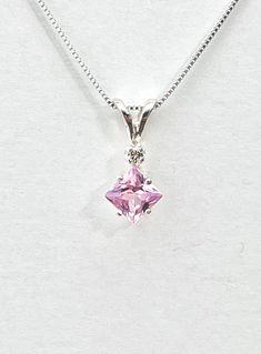 Square pink amethyst has a pink/ lavender color and measures 5.5mm x 5.5mm ( 1 carat). Tiny genuine accent diamond. Both stones were handset in sterling silver. Sterling silver box chain is 18 inches long. Comes in a gift box Pink Necklace With Diamond Accents Gift, Pink Necklaces With Diamond Accents For Gift, Purple Necklace With Prong Setting, Gift, Purple Necklace With Prong Setting As A Gift, Pink Gemstone Birthstone Necklace In Sterling Silver, Pink Pendant Jewelry With Diamond Accents, Amethyst Necklace With Accent Stones For Gift, Pink Gemstone Pendant Birthstone Necklace, Pink Kunzite Jewelry For Anniversary