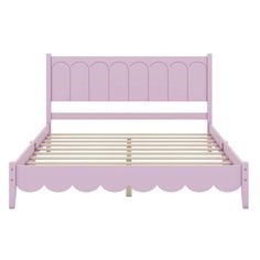 a pink bed frame with scalloped headboard and foot board