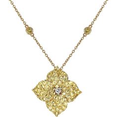 Adorn yourself with a piece of jewelry that speaks to your unique style and grace. The Mosaique Large Flower Necklace in Yellow Sapphire is a stunning statement piece that captures the essence of beauty and sophistication. With approximately 2.50 carats of round yellow sapphires set in 18K yellow gold, this necklace exudes elegance and charm. The center of the pendant features a white diamond that adds an element of luxury to the overall design. The pendant itself measures 17mm x 17mm and hangs Luxury Diamond Pendant Necklace With Jewels, Elegant Flower-shaped Large Pendant Jewelry, Elegant Flower Shaped Large Pendant Jewelry, Elegant Floral Large Pendant Jewelry, Luxury Gold Diamond Necklace With Jewels, Gold Gemstone Necklaces With Flower Design, Exquisite Flower Shaped Jewelry, Luxury Yellow Multi-stone Jewelry, Luxury Flower-shaped Necklace For Weddings