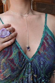 Wear this beautiful Amethyst lariat necklace and be reminded that you are everything you need! A "drop of divine" wisdom to guide you daily as the true leader of your own unique path. Trust yourself and keep moving fiercely forward. Amethyst is known for its calming and protective properties, helping to soothe the mind and bring clarity to your thoughts. Wearing this necklace is more than just an accessory; it's a reminder to stay centered, embrace your inner peace, and walk your path with confi Elegant Adjustable Gemstone Lariat Necklace, Gift Lariat Crystal Necklace With Faceted Beads, Adjustable Amethyst Dangle Necklaces, Spiritual Amethyst Necklace With Adjustable Chain, Luxury Faceted Lariat Necklace, Chakra Gifts, Angel Aura Quartz, Crystal Accessories, Crystal Suncatchers