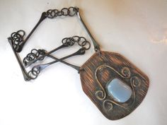 "Vintage Mexican Necklace /Modernist Necklace/ Hammered copper What a fascinating piece! From the mid to late 50s, artist made, an etched copper  piece has soldered brass piece and a bezel set blue glass stone.  The links are likewise astonishing.  Unsigned. The pendent measures 3.5L\" by 3\"W.  Total length of the chain is 26\". Pulls on." Vintage Silver Electroformed Necklaces, Vintage Metal Necklace With Patina, Vintage Patina Metal Necklace, Vintage Hand Forged Metal Necklace, Vintage Electroformed Copper Necklace, Vintage Copper Necklace, Handmade Vintage Copper Necklace, Mexican Necklace, Wanderlust Necklace