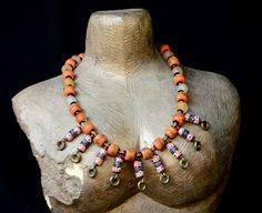 Uniquely designed to suit your blunt outfit.This orange choker drapes comfortably on your bust.It is a cute assembly of hand-painted Segi beads and orange ceramic beads.This unique Orange choker necklace is 26 inches long and the clasp has extra links to allow for adjustment. Thanks for visiting our store. Xoxoxo Atiamuga Orange Wooden Beads Jewelry For Festival, Unique Orange Necklace For Festivals, Festival Orange Large Beaded Necklaces, Artisan Orange Beaded Necklaces For Festivals, Festival Orange Large Beads Necklace, Orange Large Beaded Necklace For Festivals, Festival Orange Large Beaded Necklace, Handmade Orange Beads For Festivals, Orange Wooden Beads For Festival