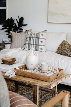 Styled Tengnanan Basket Tray on an antique Chinese coffee table. - Saffron and Poe Basket Tray Coffee Table, Coffee Table Woven Tray Decor, Coffee Table With Tray Decor, Tray On Dresser Decor, Coffee Table Basket Tray, Ottoman Tray Styling Living Room, Styling A Tray On A Coffee Table, Serving Tray On Ottoman, Decorative Tray Ideas Bedroom