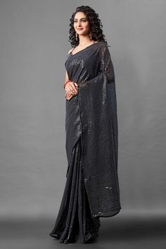 Attrective Look This Pretty Elegant Looking Designer Party Wear Saree In Black Color Paired With Blouse. This Saree Are Georgette And Blouse Are Banglori Silk Based With Designer Sequence Embroidery Work Beautified Saree. Buy Now.Product Features:  Saree Color: Black Blouse Color: Black Saree Fabric: Georgette Blouse Fabric: Banglori Silk Style Name: Designer Work: Sequence Embroidery, Piping Border Occasion: Partywear Size: Saree Length:-5.5 M Blouse Length:-0.80 M Wash Care: Dry Clean Disclaim Festive Party Wear Pre-draped Embroidered Saree, Festive Pre-draped Saree With Zari Work For Party, Festive Blouse Piece With Sequins And Traditional Drape, Diwali Sequined Traditional Drape Blouse Piece, Festive Sequined Blouse Piece With Traditional Drape, Floor-length Sequin Fabric For Diwali, Embroidered Georgette Pre-draped Saree For Party, Traditional Drape Sequin Blouse Piece For Diwali, Traditional Drape Sequined Blouse For Diwali