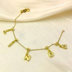 Get personal with the Minimalist Bubble Initial Bracelet! Make a statement with this sleek, gold charm bracelet adorned with bubble-style letters of your choice. The adjustable clasp guarantees a perfect fit for any wrist, so you can rock your initials or name in style. Perfect for adding a touch of individuality to your minimalist look. Initial Bracelet Gold, Style Letters, Bubble Style, Gold Charm Bracelet, Initial Bracelet, Custom Earrings, The Minimalist, Custom Bracelets, Custom Necklace