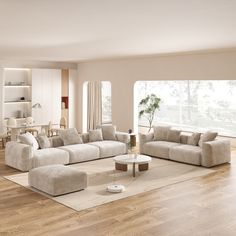 a modern living room with white furniture and wood flooring is featured in this image