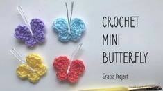 crochet mini butterflies are displayed on a white board with the words, crochet mini butterfly