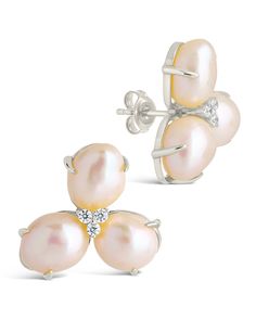 Presenting the Olive Pearl Studs, delicate and timeless earrings made of luminous pearls and clear CZ stones embedded in a stylish stud setting. These earrings, a must-have piece of luxury jewelry, will add a sophisticated sparkle to any outfit. Material: 14K gold or rhodium plated brass, cubic zirconia, shell pearl Features: 0.75" stud, 1mm CZ stones, 11mm pearls, Lead & Nickel free, post back Feminine Pearl Earrings In Silver, Feminine Silver Pearl Earrings, Evening Pearl Earrings In Diamond White, Glamorous Pearl Embellished Earrings As Gift, Diamond White Pearl Earrings For Evening, Glamorous Pearl Embellished Earrings For Gift, Silver Feminine Earrings With Pearl Charm, Feminine Silver Earrings With Pearl Charm, Feminine Silver Pearl Drop Earrings