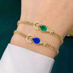 Style: Exotic Trendy Blue Bangle Jewelry, Trendy Blue Formal Jewelry, Elegant Blue Metal Chain Bracelet, Adjustable Blue Chain Bracelet For Party, Blue Metal Bracelet Jewelry, Blue Metal Jewelry With Bracelet Strap, Blue Metal Bracelet With Strap, Blue Metal Bracelet With Strap Detail, Royal Blue Bracelet