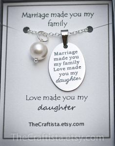 "✿ This elegant piece of jewelry will make a beautiful and sentimental gift that will best express your gratitude and love for your stepdaughter or daughter-in-law. ✿ This piece includes: ♥ authentic shell pearl pendant (8mm) ♥ disc pendant 17x24mm engraved with the words \"Marriage made you my family, Love made you my daughter.\" ♥ infinity charm (optional) ♥ 18-inch chain. ✿ Gift Card reads: Marriage made you my family Love made you my daughter ✿ This necklace is presented with a display card Meaningful White Necklaces For Mother's Day, Meaningful Jewelry For Wedding And Mother's Day, Meaningful Wedding Jewelry For Mother's Day, Inspirational White Jewelry For Mother's Day, Inspirational Customizable Jewelry For Gifts, Meaningful White Jewelry For Mother's Day, Handmade Jewelry For Anniversary And Mother's Day, Handmade Jewelry For Mother's Day Anniversary Gift, Inspirational Jewelry For Anniversary And Mother's Day