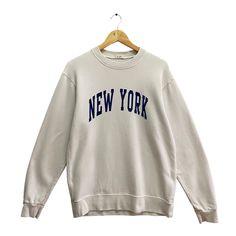 Code : p/335 Vintage New York White Sweatshirt Size Large New York Crewneck New York City  Sweater Pullover New York Spell Out Print Logo Jumper Size on Tag :  L Details Measurement  Arm Pit to Arm Pit : 22"inches Back Collar to Hem : 27"inches Condition :  Great Vintage Condition(Used Clothing).No Holes And No Stain.Please refer pictures detail.‼️ New York Crewneck, New York Shirt, New York Sweatshirt, New York Vintage, Vintage New York, Nova York, Hoodie Outfit, Sweater Pullover, Cute Sweaters