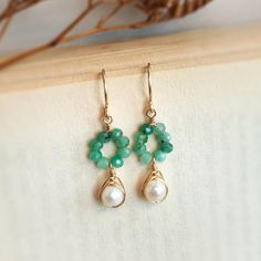 CIARA Emerald & Pearl Dangle Earrings in 14K Gold Filled or Sterling Silver • Handmade with natural green emerald gemstones & freshwater pearls. Choices of 14K Gold filled & Sterling Silver • Drop length: 2 cm • Dainty, cute, & tiny. Perfect earrings to wear every day✨ • These earrings won’t tarnish or turn color. You can wear them every day. • Hypoallergenic. You won’t have to worry about allergies from metal such as nickel. • Each pair will be packaged in a beautiful earring card and tiny craf Raw Crystal Ring, Single Stone Ring, Handmade Jewlery, Bead Diy, Earring Card, Pearl Dangle Earrings, Earring Cards, Pearl Earrings Dangle, Copper Pendants