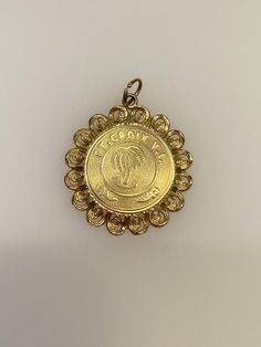 Vintage 14k yellow gold St. Croix charm. The charm weighs 3 grams of gold. 14k Gold Coin Jewelry Stamped 14k, Victorian 14k Gold Jewelry With Hallmark, Victorian Jewelry In 14k Gold With Hallmark, 22k Yellow Gold Medallion Jewelry, Vintage 22k Gold Engraved Jewelry, Antique 14k Gold Necklace With Charms, Vintage Yellow Gold Jewelry With Logo Charm, Elegant Hallmarked Charms For Collectors, Gold-plated Pendant Charms