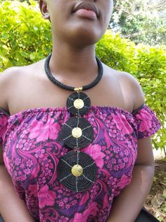 This is a fully handmade black African necklace, it is made using black longlasting fine beads. This necklace is a great jewellery piece and will match with most outfits. It is also a perfect gift for friends and family. This necklace is also available in any other colour you would prefer, request for customization by texting us or just leave a note after placing your order saying your preferred color. The necklace is very easy to put on and remove and also it is light. We offer fast shipping wo Black Adjustable Beaded Necklace, Black Bohemian Choker, Traditional Adjustable Black Beads Choker, Bohemian Black Beads Choker Necklace, Adjustable Black Necklace With Gold Beads, Festival Beaded Necklace With Round Black Beads, Black Jewelry With Beaded Chain And Round Beads, Black Beaded Choker For Jewelry Making, Bohemian Necklace With Black Beads For Festivals