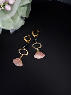 Strawberry quartz and black agate pendant earrings. The hooks are embellished with cubic zirconia and all metal components are premium quality, 18K gold plated. The earrings are long, simple but very elegant. Perfect for every day but also with a beautiful evening dress. You cannot miss the radiant beauty that emanates from these gemstones, it is truly dazzling, particularly when the light catches the facets and truly comes to life. Strawberry Quartz is delicious and energizing. It is a one of a kind stone that emits some amazing vibrations that are possibly life changing. The basic meaning of Strawberry Quartz is that it is the stone of love. The rosy pink crystal energy embraces you with thoughtful affection. The power of love can alter even the darkest situations. This stone has an exce Modern Natural Stone Earrings For Formal Occasions, Modern Onyx Drop Earrings, Modern Handmade Earrings For Evening, Modern Handmade Evening Earrings, Gemstone Dangle Earrings For Evening, Black Natural Stones Drop Earrings, Fine Jewelry Drop Earrings With Natural Stones, Onyx Drop Earrings Jewelry Gift, Onyx Drop Earrings As A Gift