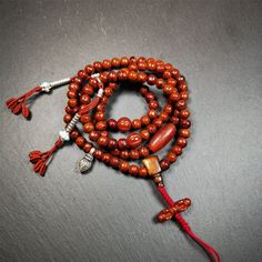 ❤This bodhi beads mala is made by Tibetan craftsmen and come from Hepo Town, Baiyu County, the birthplace of the famous Tibetan handicrafts,about 30 years old, hold and blessed by a lama in Baiyu Monastery.It is composed of 108 bodhi seed beads, and is equipped with 3 agate beads, silver bead counters are installed on both sides, 1 mani jewel bead clip,and finally consists a bone guru bead and vajra on the end, very elegant.❤Details1. Handmade 108 bodhi beads approximately 8mm,mala's perimeter i Artisan Wooden Beads Bracelet For Meditation, Adjustable Artisan Mala For Rituals, Artisan Wooden Beads Bracelets For Meditation, Handmade Spiritual Mala For Rituals, Brown Mala For Healing And Festivals, 8mm Amber Beads For Spiritual Use, 8mm Amber Spiritual Beads, Bohemian Mala With 8mm Beads For Blessing, Traditional Handmade Mala For Meditation