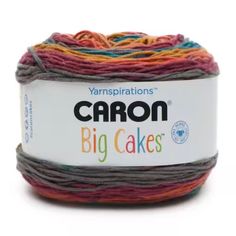 yarn ball in multicolors with the words carbon big cakes written on it's side