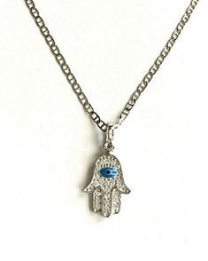 "925 STERLING SILVER HAMSA AND EVIL EYE PENDANT . HAMSA AND EVIL EYE FOR PROTECTION AND GOOD LUCK. 16\" LONG GUCCI CHAIN. PENDANT SIZE 20 X 10 mm CADENA DE 925 PLATA ESTERLINA MANO DE FATIMA Y OJO DE LA BUENA SUERTE. LA MANO DE FATIMA Y OJO PARA BUENA SUERTE Y PROTECCION. 16\" LARGO GUCCI CADENA .. TAMAÑO DEL DIJE : 20 X 10 mm" Sterling Silver Spiritual Necklace, Sterling Silver Round Pendant Charm Necklace For Good Luck, Sterling Silver Charm Necklace For Good Luck, Sterling Silver Pendant Charm Necklace For Good Luck, Silver Pendant Necklace For Good Luck, Sterling Silver Engraved Necklace For Good Luck, Sterling Silver Good Luck Charms Necklace, Symbolic Sterling Silver Good Luck Charm Necklace, Silver Symbolic Necklaces For Good Luck