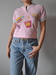 Vintage junk food graphic tee  'Self Service' tee brand is Harley 80's Era MATERIAL: cotton, polyester. Made in Canada SIZE: Labelled size 10 fits women up to size x-small/small best * Model is 5'6" and usually wears size small (US4) MEASUREMENTS: length: 18.5" bust: 34" sleeve: 4.5" width (shoulder seam-seam): 18"   CONDITION: Great vintage condition. Note: items are in preowned condition and may come with little flaws. If there are any major flaws, they will be indicated through description an Vintage Junk, Fits Women, Best Model, Junk Food, Favorite Outfit, Gender Neutral, Graphic Tees, Bathing Beauties, Adult Outfits