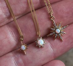 A sweet small, delicate and dainty celestial necklace. Give the gift of good vibes and positivity, or a little self love. Your choice of 3 styles of lovely, shimmery synthetic opal and cubic zirconia necklaces. *Note: the photos have been enlarged to show the detail, these are small and dainty necklaces- please message me if you need more photos to demonstrate necklace size! ⟴ Large North Star Meaning: represents a beacon of inspiration and hope, a guiding light leading toward a purposeful desti Black Agate Necklace, Raw Stone Jewelry, Moon Phases Necklace, Cubic Zirconia Necklace, Celestial Necklace, Synthetic Opal, Boho Pendant, Celestial Jewelry, Amethyst Necklace