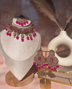 Capture the lush magnificence of India with this stunning Indian necklace set. From classic Pakistani jewelry to modern wedding jewelry designs, this necklace set will add a touch of sophistication to your Bollywood-inspired look. Accented with delicate pink choker stones and intricate polki earrings, this elegant piece of Indian jewelry is perfect for any eid or special occasion. Elevate your style and express yourself with this gorgeous Indian choker set. Pink Bridal Necklace With Matching Earrings As A Gift, Elegant Kundan Choker With Intricate Design, Elegant Kundan Bridal Choker Necklace, Elegant Kundan Choker Necklace With Intricate Design, Elegant Festive Choker With Intricate Design, Elegant Choker For Formal Festivals, Pink Bridal Necklace With Matching Earrings For Wedding, Elegant Festive Bridal Choker Necklace, Elegant Wedding Choker For Festivals