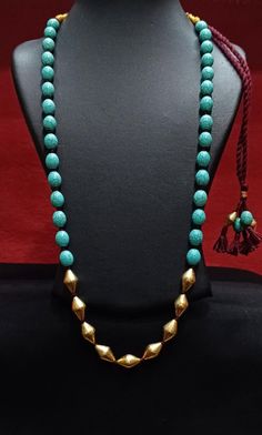 Silver Gold plated Turquoise Dholki Necklace- Long Beaded Blue Necklace- Handmade Indian Jewelry for women- Gemstone bollywood necklace-Gift Dholki Beads Silver Necklace with semiprecious beads. Length 24 inches + extra thread to increase length Disclaimer-This necklace is made of Dholki silver beads that are wax filled. Thus it comes without 925 Silver Hallmarking. Hallmarking process involves the application of a strong force to engrave on the metal, and the dholki beads may get disfigured, due to their intricate craftsmanship. Traditional Turquoise Jewelry With Latkans, Handmade Jewelry With Round Beads For Navratri, Traditional Turquoise Necklace With Meenakari, Traditional Turquoise Jewelry For Diwali, Traditional Turquoise Meenakari Necklace, Temple Jewelry Turquoise Necklaces For Festivals, Turquoise Jewelry With Latkans For Festivals, Turquoise Temple Jewelry Necklaces For Festivals, Traditional Round Beads Necklaces For Navratri