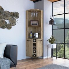 a living room filled with furniture next to a window and a wall mounted wine rack