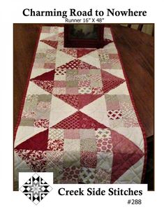 a table runner made with red and white quilts