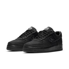 The Nike Stussy x Air Force 1 Low 'Triple Black' is a sleek and stylish sneaker that's perfect for everyday wear. With its breathable hemp construction, this sneaker is comfortable and easy to wear, while the split-embroidered Swoosh and Stussy's double S logo add a touch of style. The interlocking letters on the heel tab and tongue tag are also a nice touch, while the World Tour iconography on the tongue tag is a nice finishing touch. Nike Athleisure Custom Sneakers, Modern Nike Air Force 1 Lace-up With Branded Insole, Modern Cushioned Sneakers For Streetwear, Nike Air Force 1 With Modern Style, Streetwear Running Shoes With Textured Sole, Modern Nike Air Force 1 With Boost Midsole, Modern Sneakers With Textured Sole For Streetwear, Functional High-top Sneakers With Textured Sole For Streetwear, Sporty Carbon Running Shoes For Streetwear