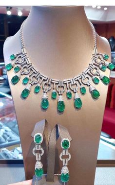 An exceptional Art Deco style parure, complete with earrings and necklace, so stunning and refined , a very piece of art. Necklace come in 18k gold with natural emeralds from Zambia, fine quality, in cabochon cut of 76,40 carats, and 641 pieces of natural diamonds of 8,68 carats, F color and VS clarity. Earrings come in 18k gold with 4 pieces of natural emeralds from Zambia, fine quality, of 19,93 carats, and 142 pieces of natural diamonds of 2,95 carats, round brilliant cut, F color and VS clar Italian Art Deco, Art Deco Emerald, Zambian Emerald, Earrings And Necklace, Italian Art, Natural Emerald, Art Deco Style, Deco Style, Luxury Jewelry